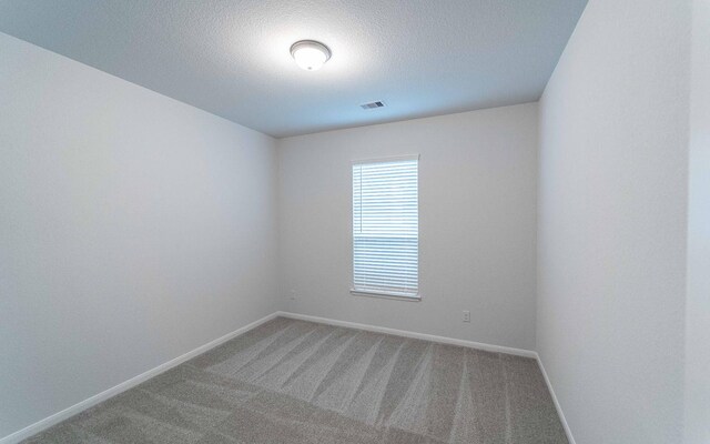 13709 Seneca Lake Dr, Texas City, TX 77568 - unfurnished room featuring carpet flooring, baseboards, and a textured ceiling