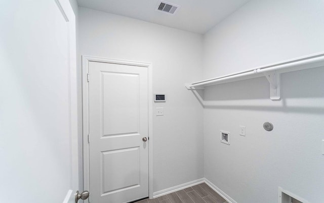 13709 Seneca Lake Dr, Texas City, TX 77568 - washroom with baseboards, dark wood-type flooring, hookup for a washing machine, and gas dryer hookup