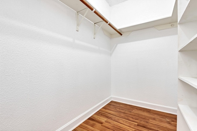 spacious closet featuring wood finished floors