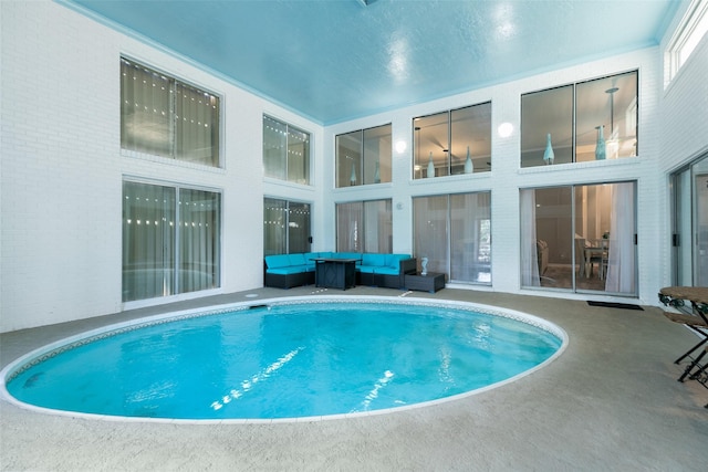 34 Lakeview Dr, Galveston, TX 77551 - pool with a patio area and an outdoor living space