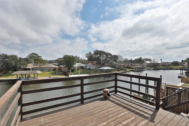 view of dock featuring a water view and a residential view