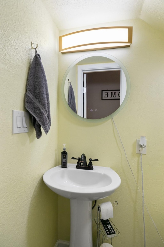 bathroom with vaulted ceiling