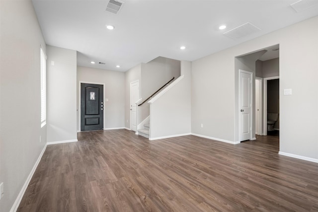 23923 Falling Daylight Dr, Hockley, TX 77447 - unfurnished living room featuring dark wood-style flooring, stairway, baseboards, and recessed lighting
