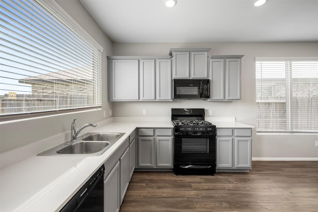 23923 Falling Daylight Dr, Hockley, TX 77447 - kitchen with black appliances, gray cabinets, a sink, light countertops, and recessed lighting