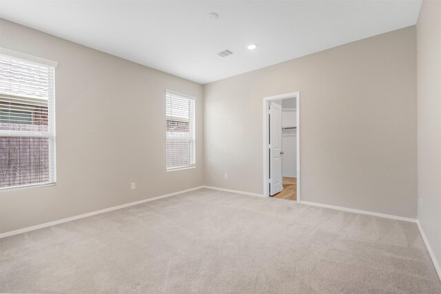 23947 Falling Daylight Dr, Hockley, TX 77447 - spare room featuring baseboards, light carpet, and recessed lighting
