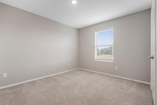 23947 Falling Daylight Dr, Hockley, TX 77447 - spare room featuring baseboards and light carpet