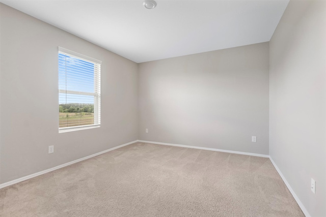 23947 Falling Daylight Dr, Hockley, TX 77447 - unfurnished room featuring baseboards and light carpet