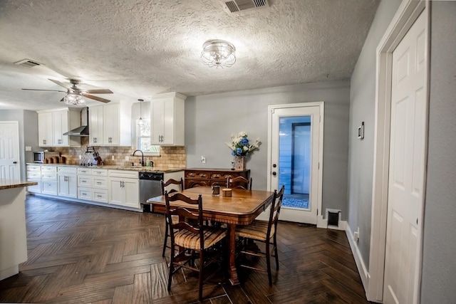dining area featuring a ceiling fan and baseboards