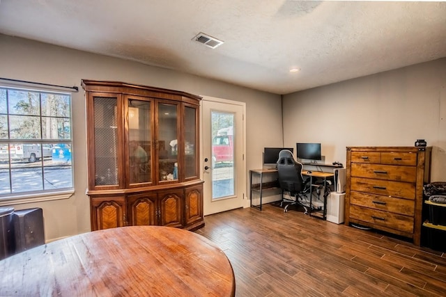 office area with dark wood-style floors, plenty of natural light, recessed lighting, and baseboards