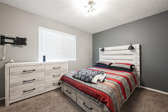 bedroom featuring carpet floors, a textured ceiling, and baseboards