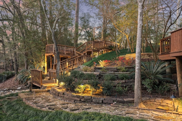 view of yard with stairway and a deck