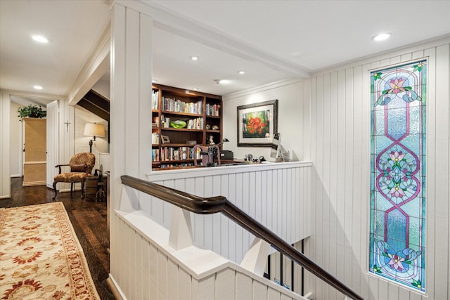 interior space with built in shelves, recessed lighting, and dark wood finished floors