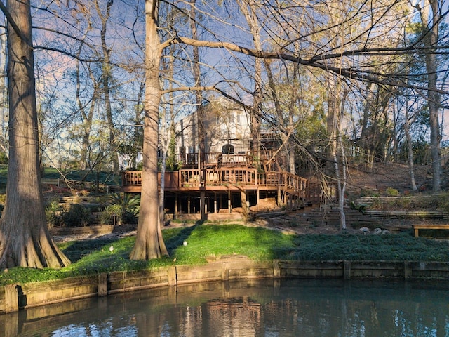 back of house with stairway and a wooden deck