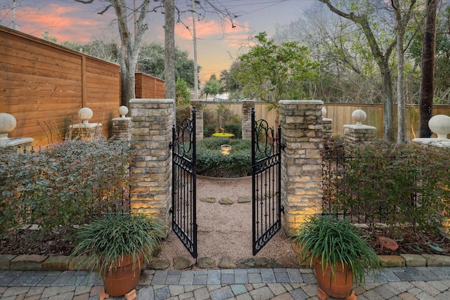 view of gate with fence