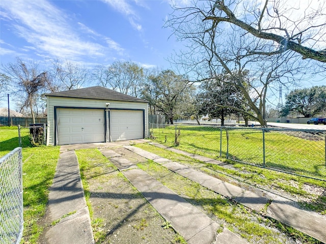 detached garage featuring fence