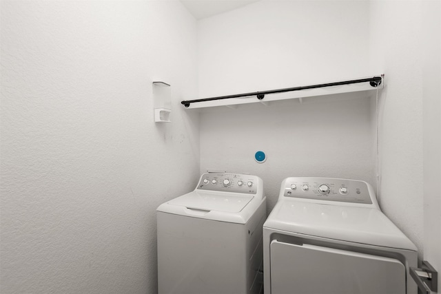 clothes washing area featuring laundry area and independent washer and dryer