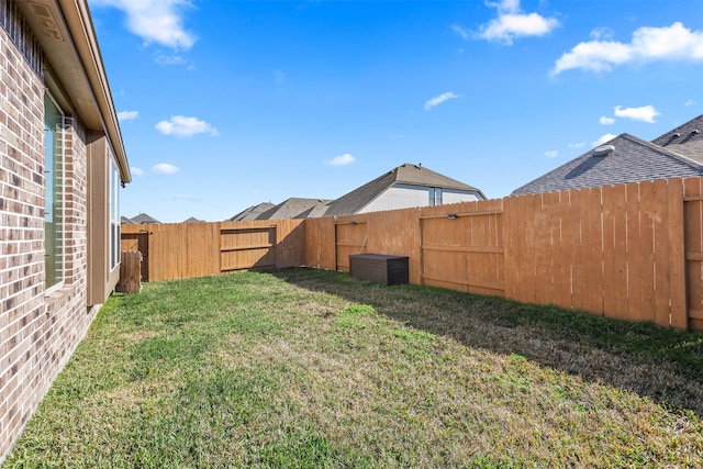 view of yard with a fenced backyard