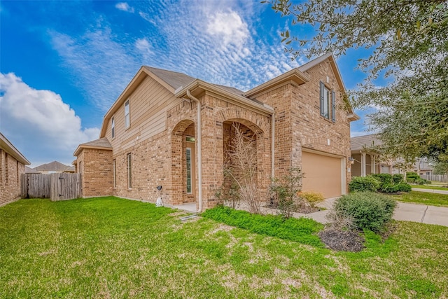 view of front facade featuring a garage, concrete driveway, fence, a front lawn, and brick siding