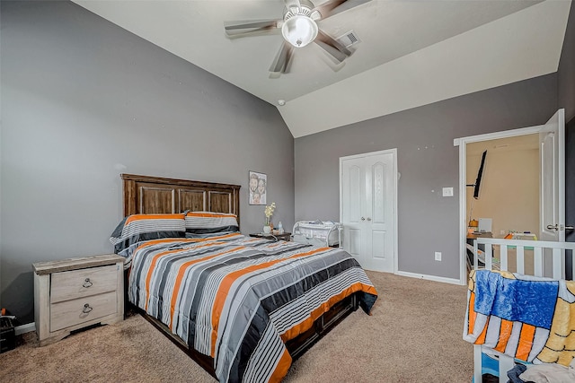 carpeted bedroom with lofted ceiling, baseboards, and a ceiling fan