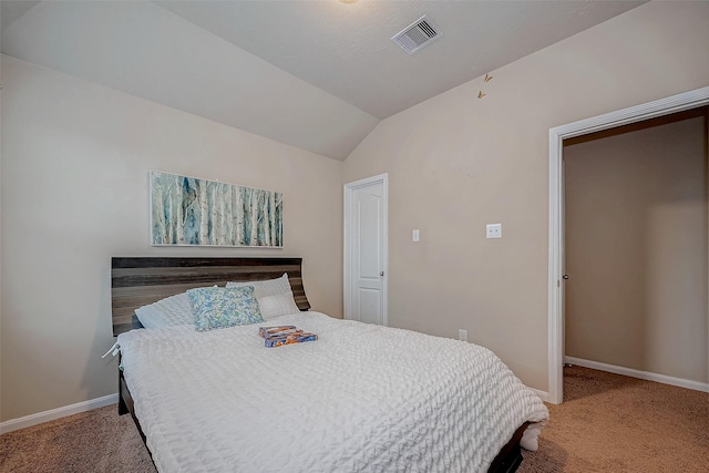 carpeted bedroom with lofted ceiling, visible vents, and baseboards