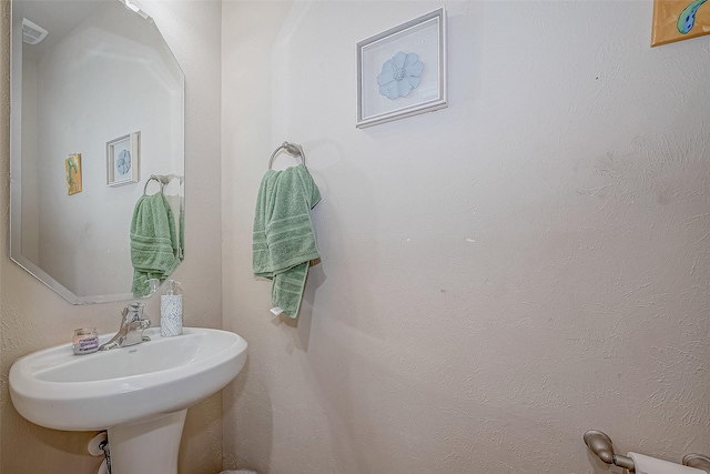 bathroom with a sink and visible vents