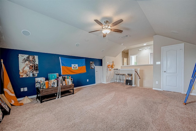 game room featuring ceiling fan, carpet flooring, visible vents, baseboards, and vaulted ceiling