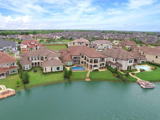 bird's eye view with a water view and a residential view