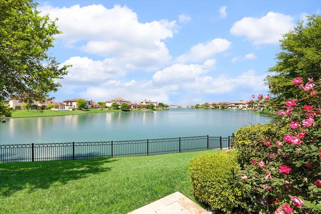 water view with a residential view and fence