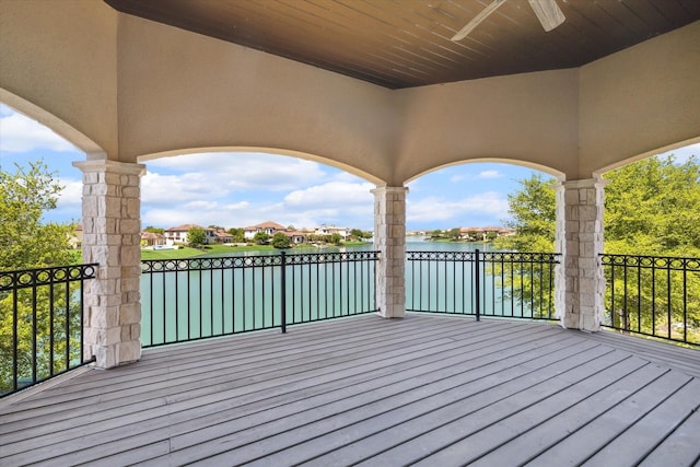 wooden deck featuring a water view