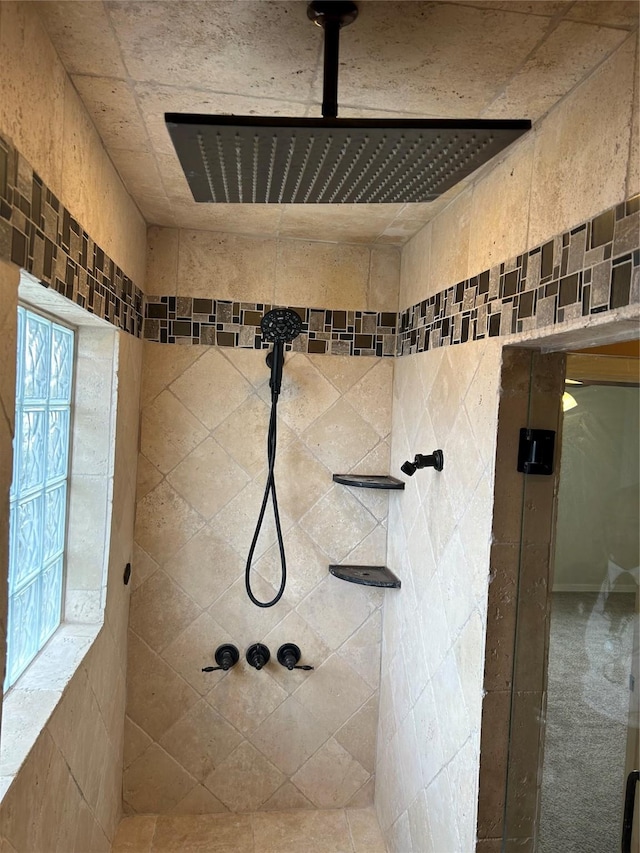 full bath with tiled shower