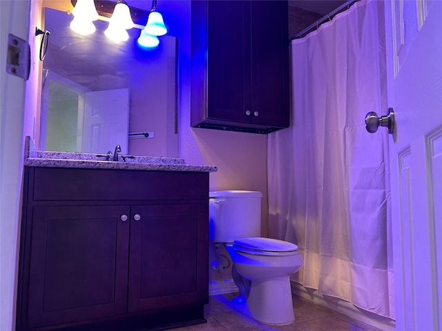 full bath with toilet, tile patterned floors, and vanity