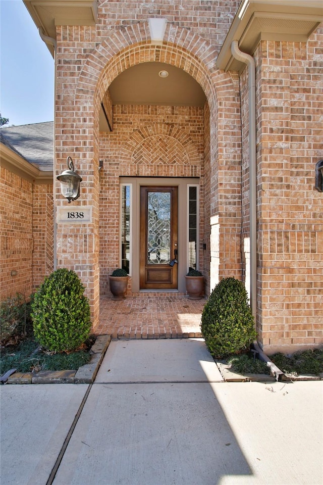 entrance to property with brick siding