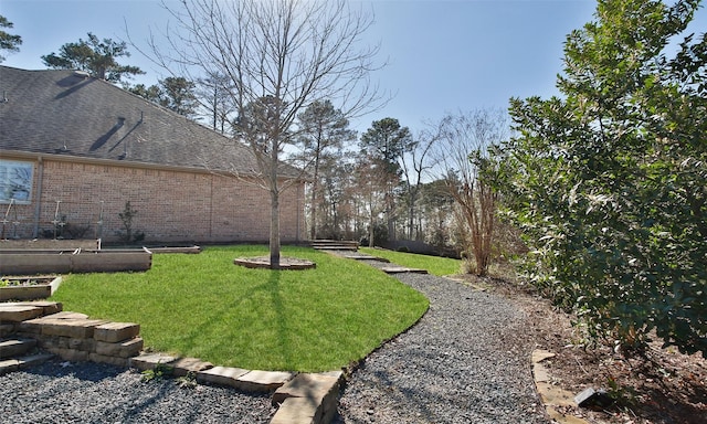 view of yard featuring a vegetable garden