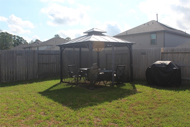 view of yard with a fenced backyard and a gazebo