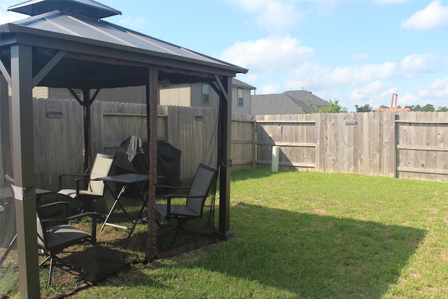 view of yard with a gazebo and a fenced backyard