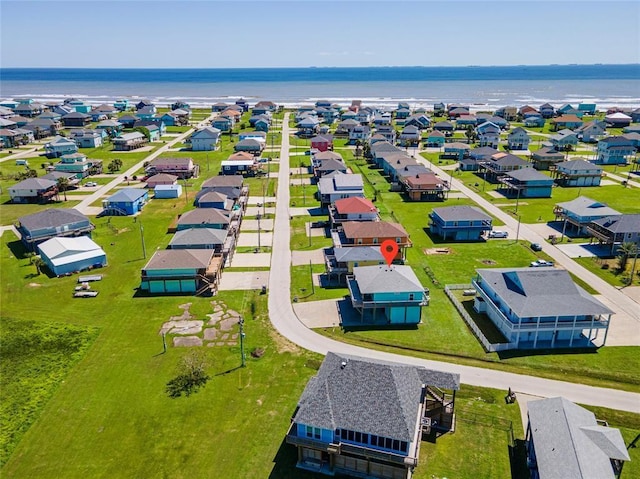 bird's eye view featuring a residential view and a water view