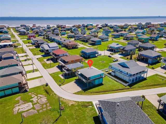 aerial view featuring a residential view and a water view