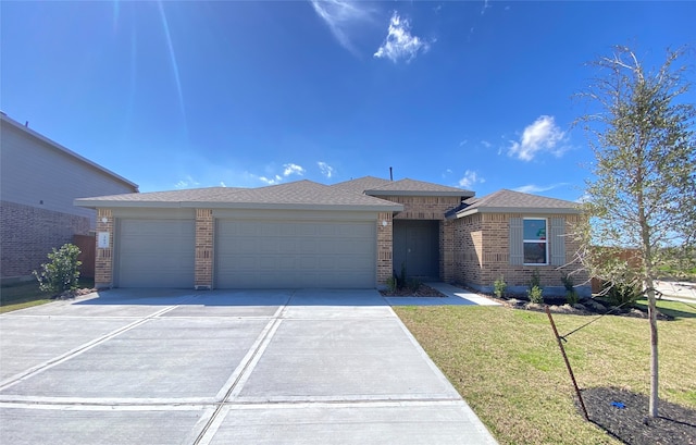 view of front of home featuring an attached garage, brick siding, concrete driveway, roof with shingles, and a front yard