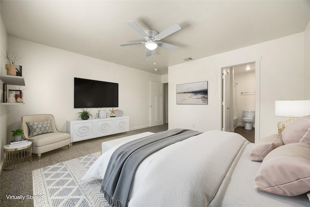 bedroom with ensuite bath, visible vents, and a ceiling fan