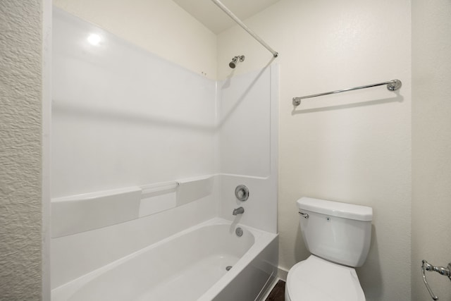 bathroom featuring toilet and shower / bathtub combination