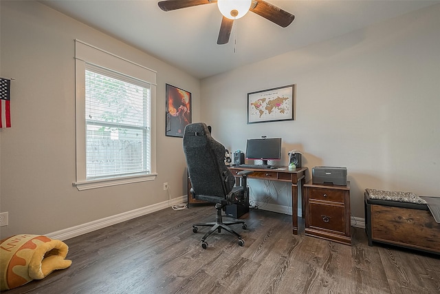 office featuring wood finished floors, a ceiling fan, and baseboards