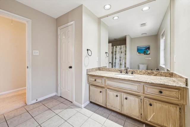 1319 Breezy Bend Dr, Katy, TX 77494 - full bath featuring vanity, baseboards, tile patterned floors, toilet, and visible vents