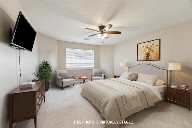 1319 Breezy Bend Dr, Katy, TX 77494 - bedroom featuring ceiling fan, a textured ceiling, visible vents, light carpet, and baseboards