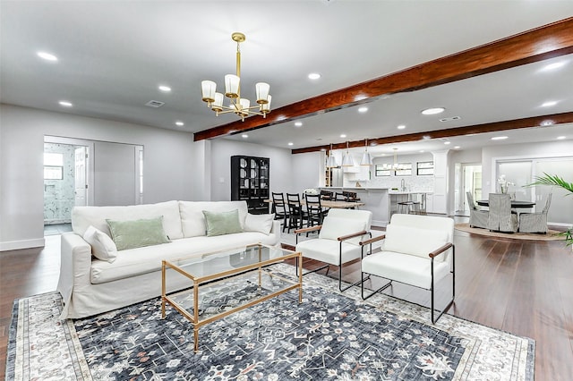 living room featuring visible vents, wood finished floors, beam ceiling, a notable chandelier, and recessed lighting