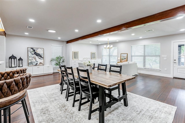 dining room featuring dark wood-type flooring, visible vents, and beamed ceiling