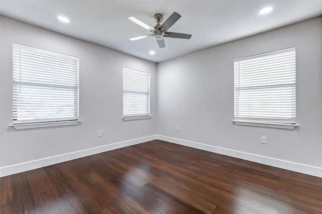 unfurnished room featuring recessed lighting, dark wood-style flooring, ceiling fan, and baseboards