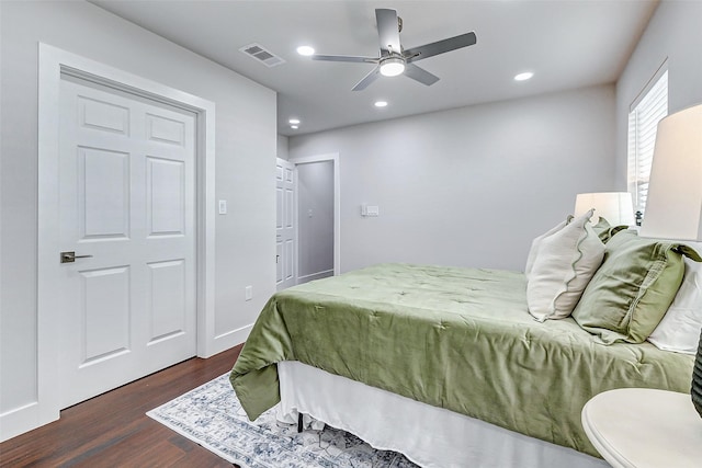 bedroom with dark wood-style floors, ceiling fan, visible vents, and recessed lighting