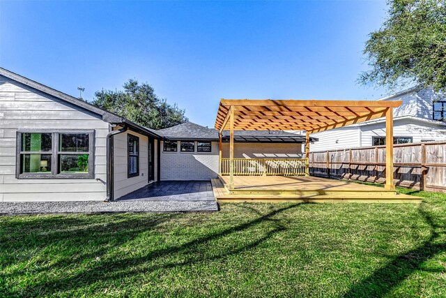 view of yard featuring fence and a pergola
