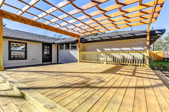 deck with fence and a pergola