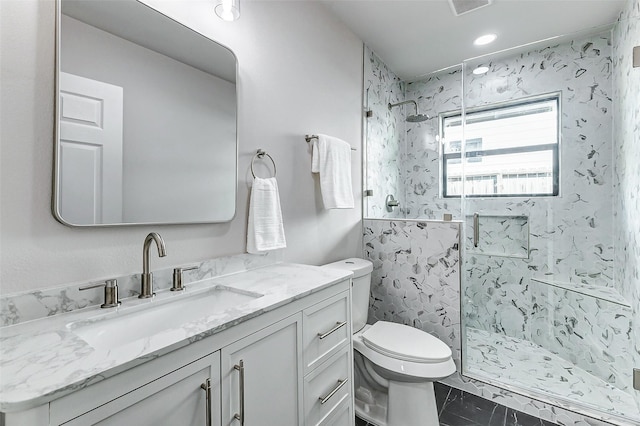 full bath with marble finish floor, recessed lighting, toilet, a shower stall, and vanity